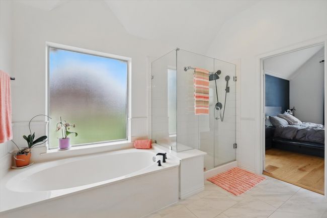 Large, roomy master bath with separate tub and shower. | Image 21