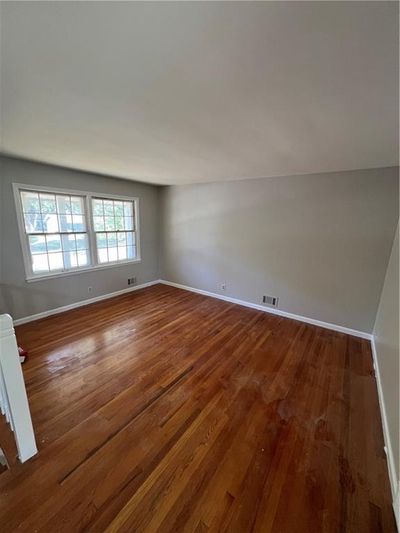 Empty room featuring wood-type flooring | Image 2