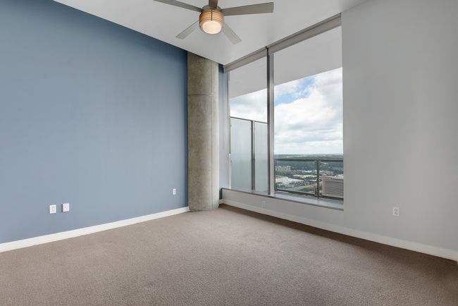 Carpeted empty room featuring ceiling fan and baseboards | Image 20