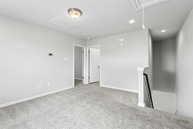 Spare room with attic access, carpet, and recessed lighting | Image 21