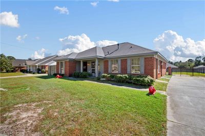 Ranch-style home with a front lawn | Image 2