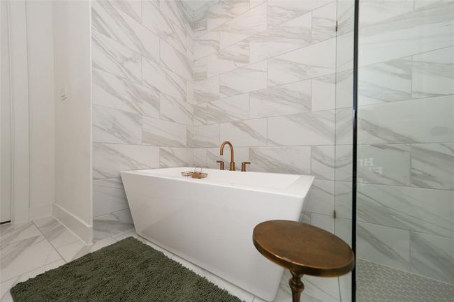 Luxurious soaking tub for ultimate relaxation. | Image 24