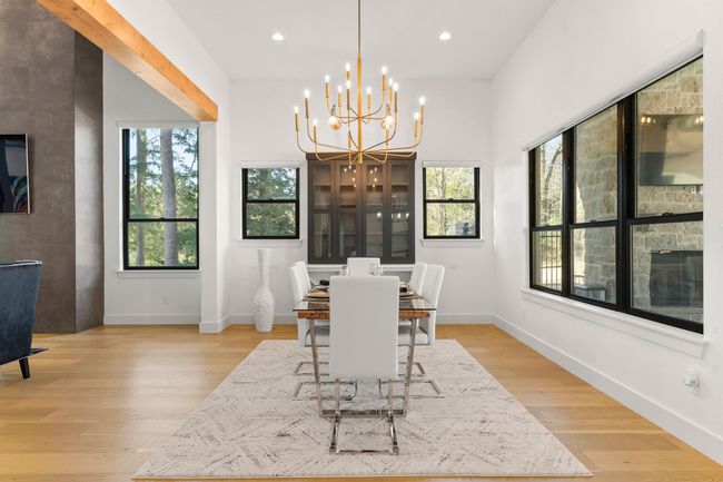 Dining space with light wood-style flooring, baseboards, a chandelier, and recessed lighting | Image 8