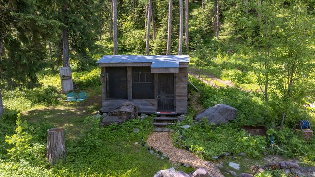 View of outdoor structure featuring a view of trees | Image 55