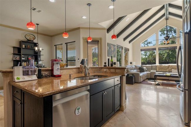 and providing a large pantry with direct access from the garage. | Image 13