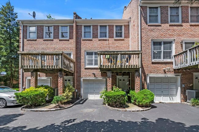 View of front of house with an attached garage, driveway, and brick siding | Image 20