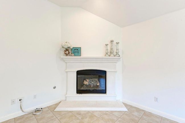 Details featuring baseboards and a fireplace | Image 14