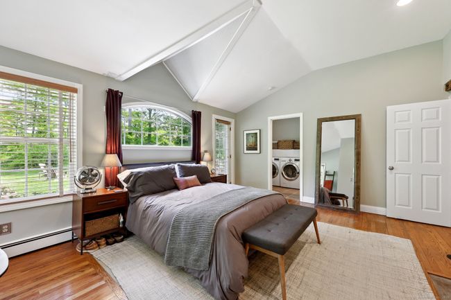 Vaulted ceiling, recessed carpet under bed. | Image 13