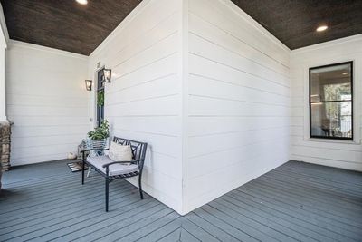 The front porch wraps around the house, giving plenty of space for everyone to relax comfortably. | Image 3