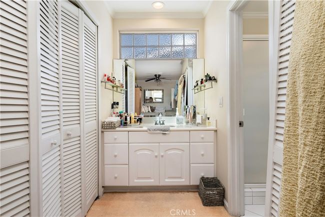 primary bedroom walk-in closets | Image 40
