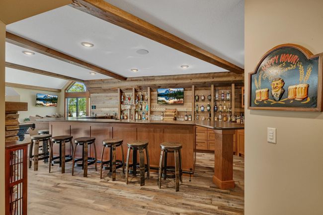 Lounge area offering a polished bar and recreational space for relaxed gatherings. | Image 69