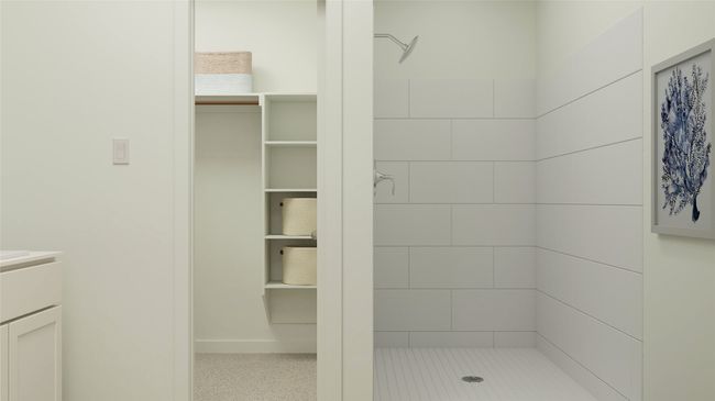 Bathroom with vanity and tiled shower | Image 19
