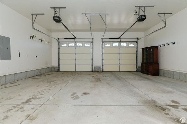 Garage with electric panel and a garage door opener | Image 44