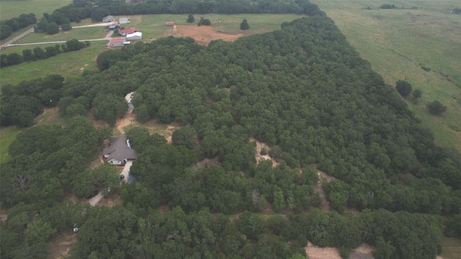 Aerial overview of property's location with rural landscape and a forest | Image 25