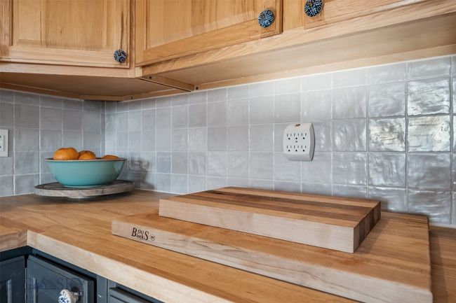 tiled back splash, butcher block counters | Image 19