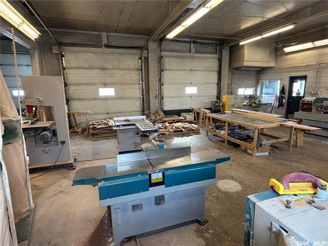 Garage featuring a workshop area | Image 25