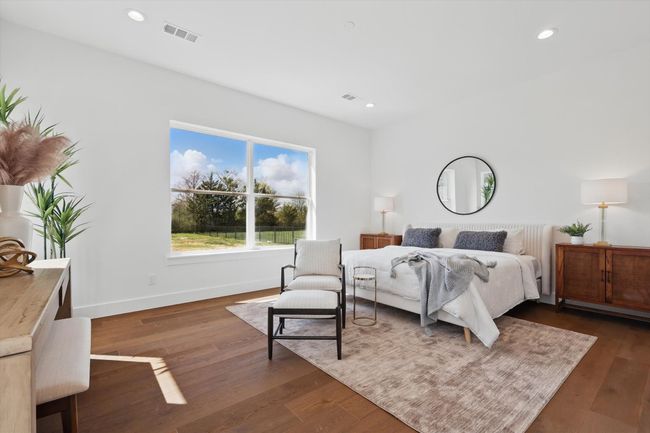 Bedroom with dark wood-style flooring, visible vents, and recessed lighting | Image 16