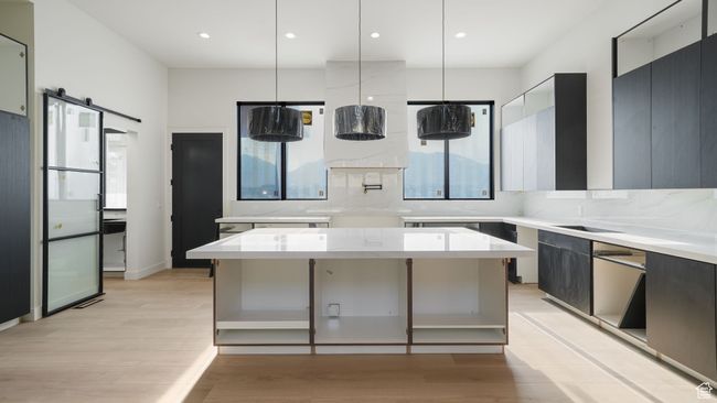 Progress pictures, 7/11/25Kitchen featuring plenty of natural light, backsplash, modern cabinets, light wood-type flooring, and recessed lighting | Image 8