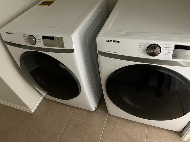 Washroom with tile patterned floors, washer and dryer, and baseboards | Image 26