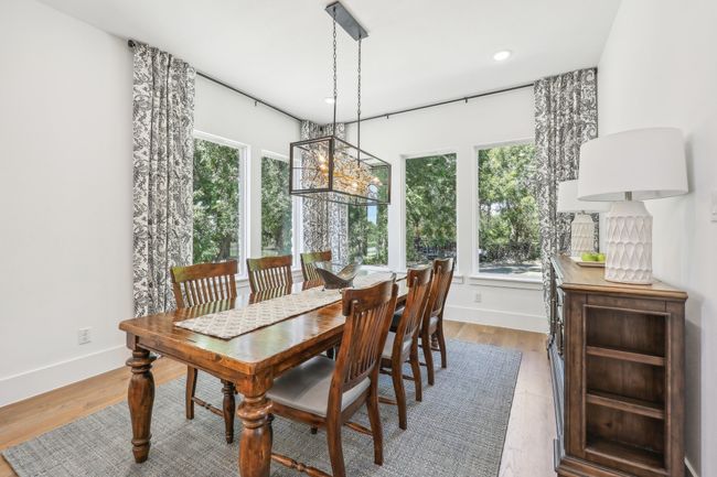 Dining area featuring light wood-style flooring and recessed lighting | Image 14
