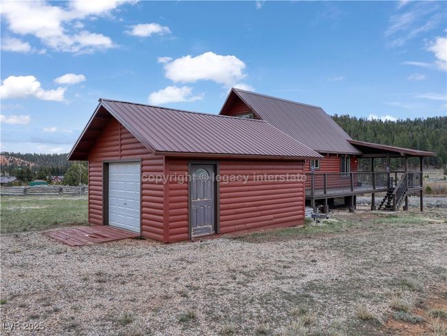Garage featuring a forest view | Image 39