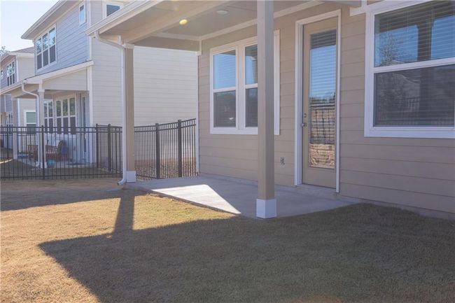 Property entrance with a patio | Image 7