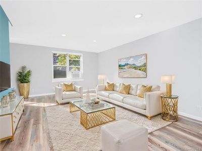 Living room featuring light hardwood / wood-style floors | Image 1