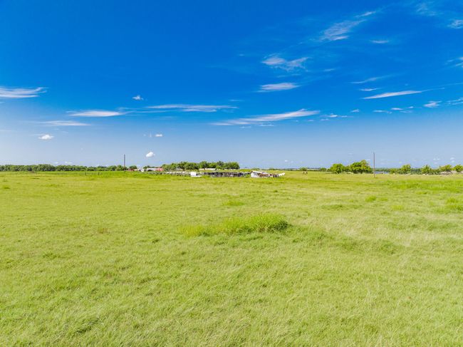 View of green lawn featuring a view of countryside | Image 10
