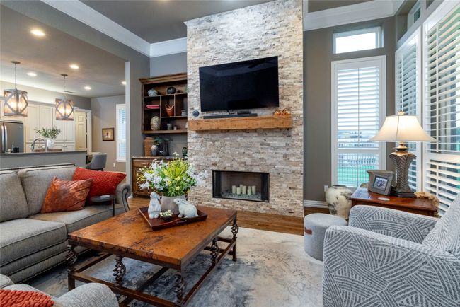 Living area with views of the kitchen with designer lighting | Image 16