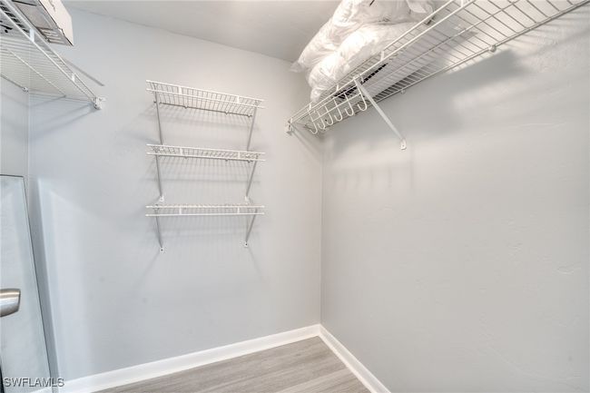 Spacious closet with hardwood / wood-style flooring | Image 8