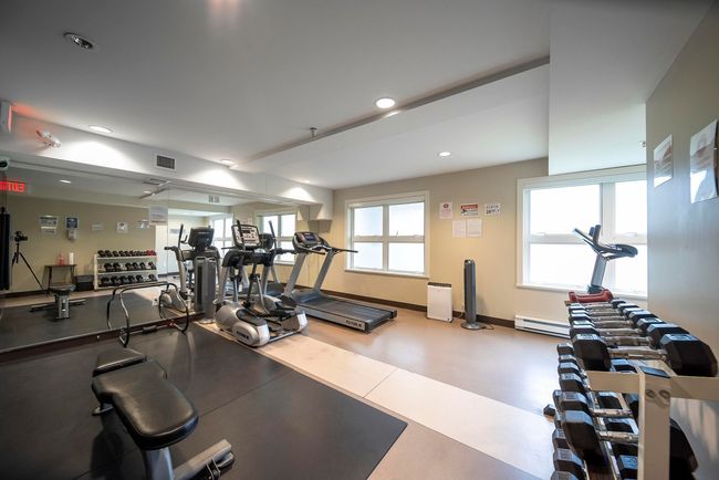 Workout area with visible vents, a baseboard radiator, recessed lighting, and baseboards | Image 24