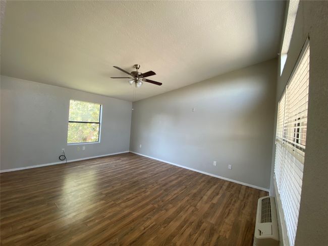 This unit is partnered with a charming kitchen, equipped with tons of cabinetry, and lots of cabinet space. | Image 6