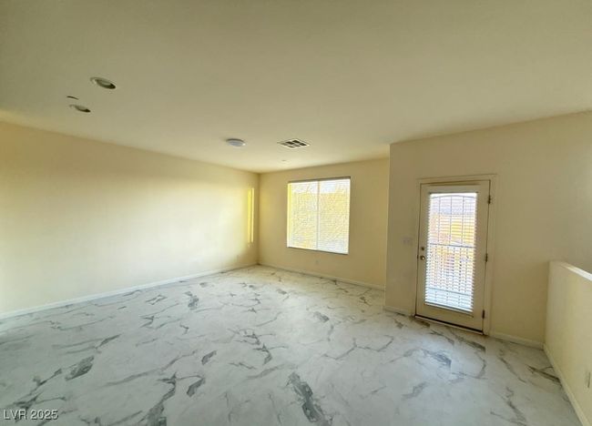 Empty room featuring marble finish floor, visible vents, and baseboards | Image 4