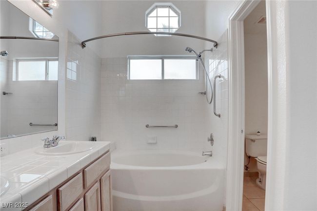 Full bath featuring double vanity, tub / shower combination, and duel sinks | Image 22