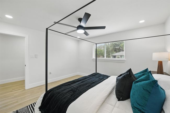 Bedroom with wood finished floors, baseboards, recessed lighting, and ceiling fan | Image 21