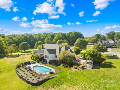 Grand in-ground pool & koi pond with waterfall | Image 2