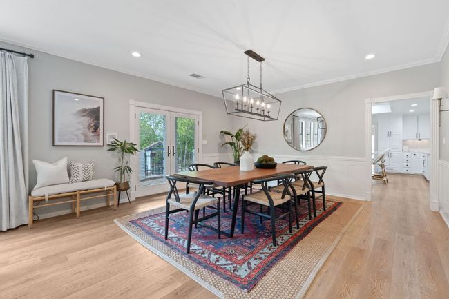 Dining space featuring crown molding, a chandelier | Image 10