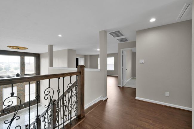 Upstairs Foyer with the staircase on the left, and Game Roomin the middle. | Image 22