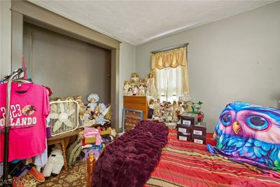 Bedroom featuring a textured ceiling | Image 3