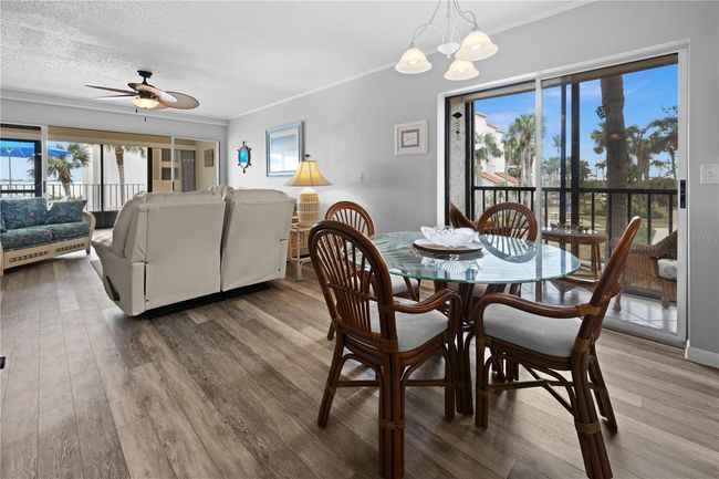 Dining Room with Side Balcony in background. | Image 12