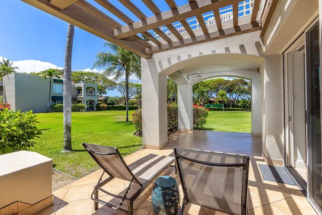Access the expansive lanai from the primary suite through its sliding glass/screen door & down a few | Image 30