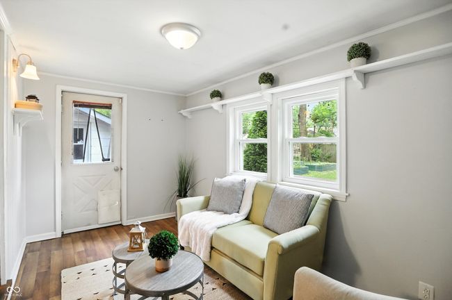 living area featuring hardwood / wood-style floors and ornamental molding | Image 18