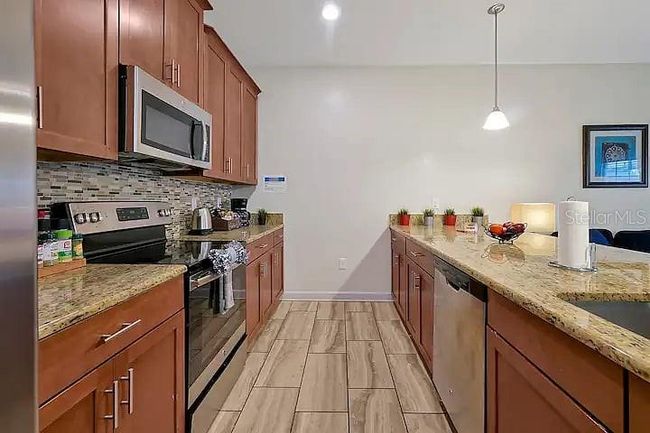 1581 Moon Valley Dr, Townhouse with 4 bedrooms, 3 bathrooms and null parking in CHAMPIONS GATE FL | Image 4