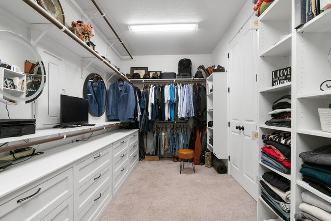 The walk-in closet includes built-in shelving/drawers and is sure to provide plenty of space for your wardrobe. | Image 21