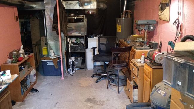 Unfinished basement with gas water heater and furnace | Image 42