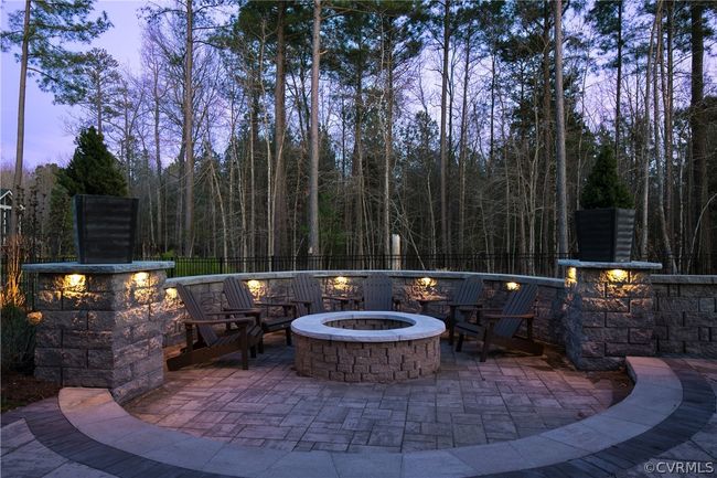 Patio terrace at dusk featuring an outdoor fire pit | Image 47