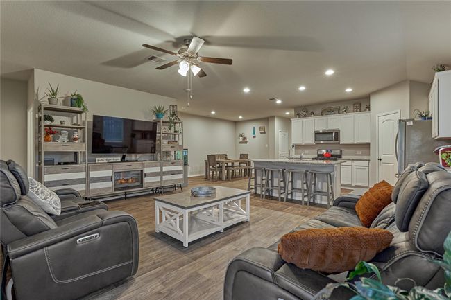This light and bright space provides open-concept living and is perfect for entertaining. | Image 19