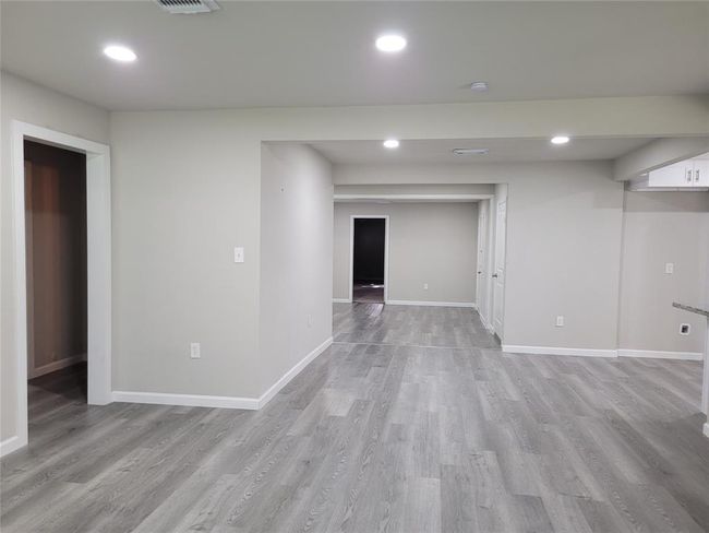 To the left is the hall to the first and second bedrooms | Image 13