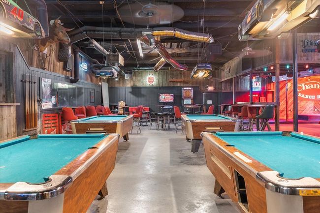 Playroom with billiards and concrete floors | Image 8