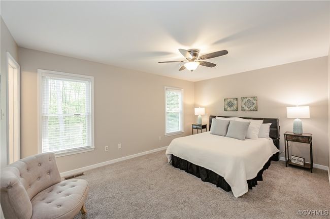 Primary with visible vents, baseboards, and light colored carpet | Image 30